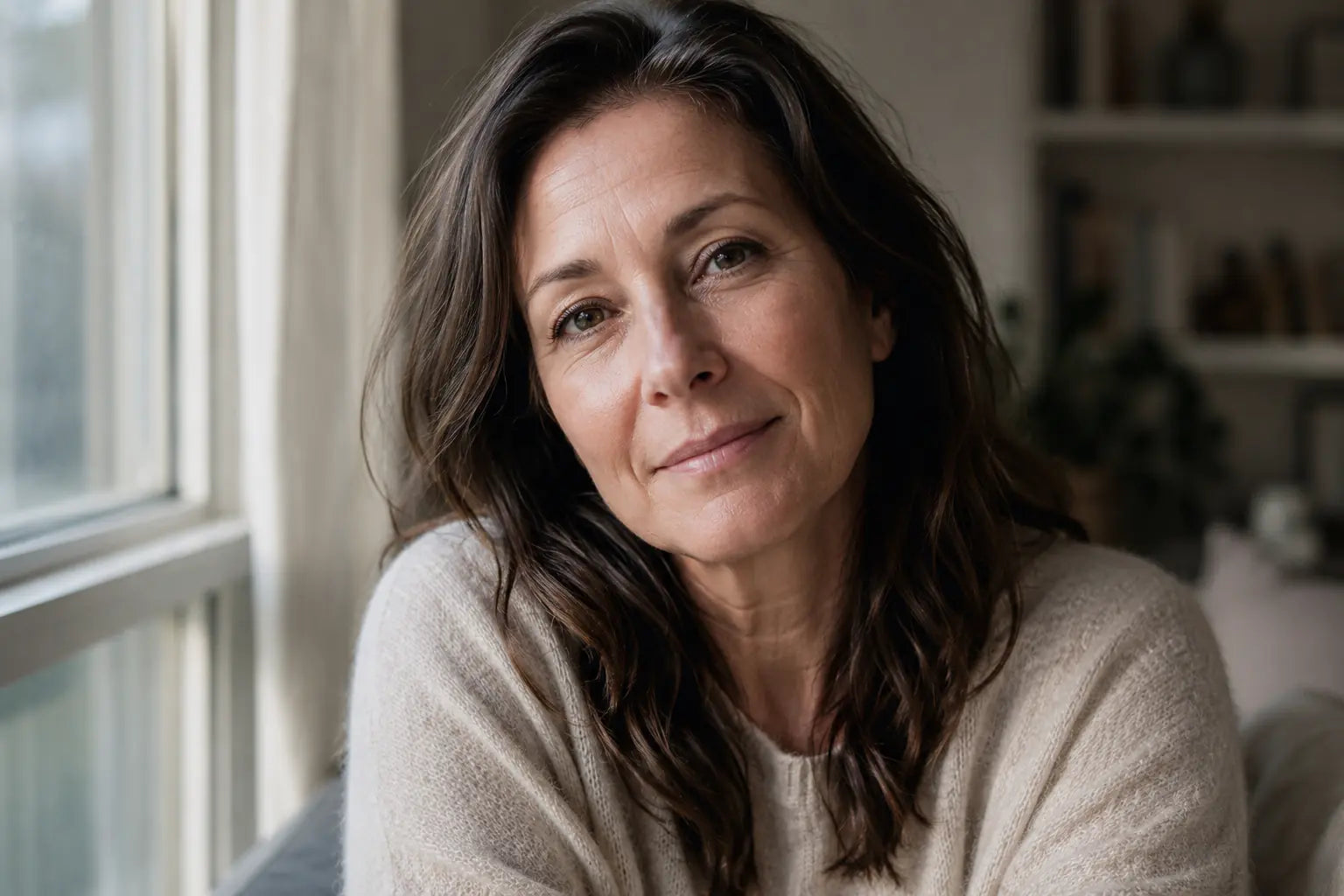 Calm warm portrait of a woman looking at the camera